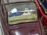 a toy car with a man and a woman inside of it