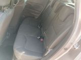 the back seats of a car with a seat belt in the back of it
