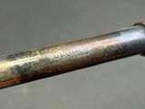 a close up of a metal pipe with a metal handle