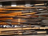 many different types of wooden arrows in a box