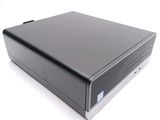 an image of a black desktop computer sitting on top of a white surface