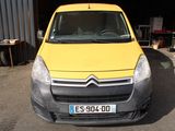 a yellow van that is parked in front of a building