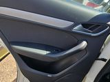 the door of a car with the door open and the driver ' s side door open
