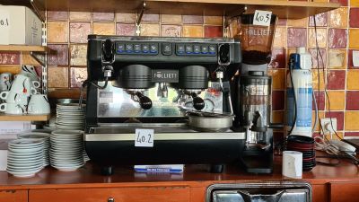 a coffee machine sitting on a counter in a kitchen