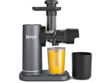 un gros plan sur un presse-agrumes avec un verre de jus d'orange