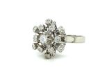an image of a diamond cluster ring on a white background