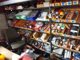 many shelves of assorted items in a room