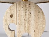 an elephant lamp with a woven shade on top of it