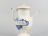 a white tea pot with a blue dragon on it