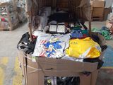 a cardboard box filled with assorted items in a warehouse