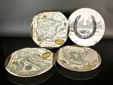 three plates with a map on them sitting on a table