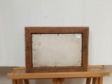 a picture frame sitting on top of a wooden table