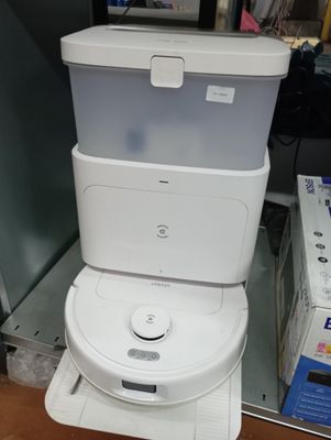 a white toilet sitting on top of a stack of boxes