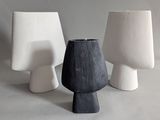 three vases that are sitting next to each other on a table