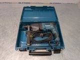a close up of a blue box with a drill and a cord