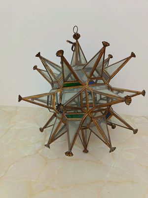a glass starburst that is on a table