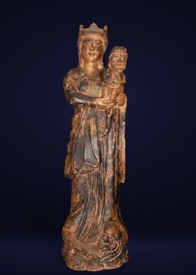 a statue of a woman holding a child in her arms