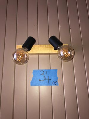 two light bulbs that are attached to the wall