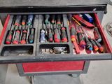 many tools in the drawer of a workbench