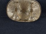 a close up of a hat with a metal buckle on it