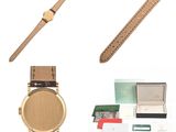 an image of a watch and other items on a white surface