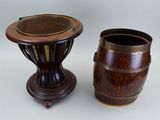 two wooden vases sitting next to each other on a table