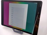 a tablet with a menu on the screen on the table