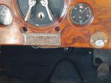 a close up of the dashboard of an old car