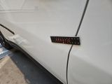 a sticker on the side of a white car that says don ' t drive