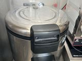 stainless steel counter top with a blender and a blender sitting on top of it