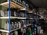 many cans of gas are stacked on the shelves in the garage