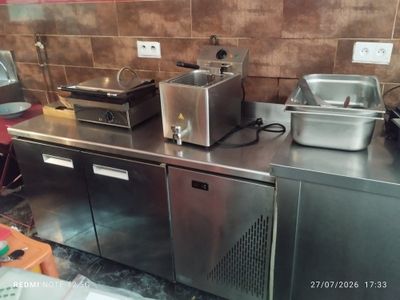 many different types of food on the counter in this kitchen