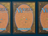 three decks of magic the gathering are shown on a blue background