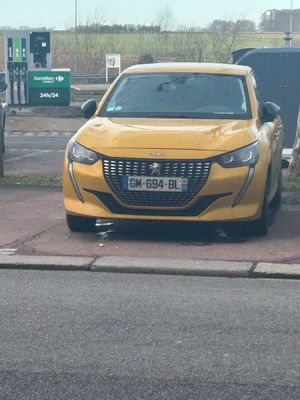 a yellow car that is parked on the side of the road