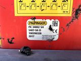 a small piece of metal on the side of a red box