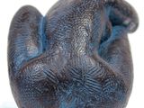 a figurine of an elephant that is laying down