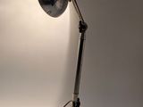 a lamp that is sitting on a table in the room