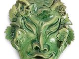 une image représentant le visage d'un homme vert orné de feuilles