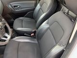 the interior of a car with black leather seats and a steering wheel