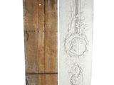 two pieces of wood with a drawing of a sword on it