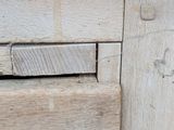 a close up of a piece of wood with a hole in it