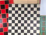 a box with a checker board and a game set in it