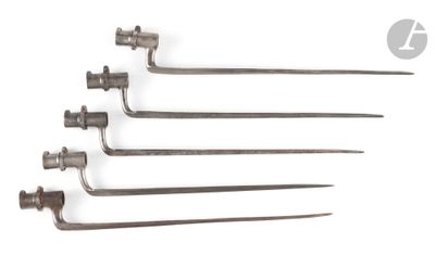 a set of five metal forks with a long handle on a white background