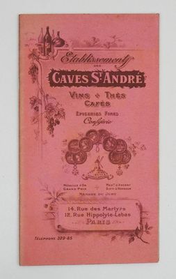 un vieux livre avec une couverture rose et l'image d'un verre à vin