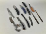many different types of knives on a white surface