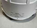 a white helmet sitting on top of a table