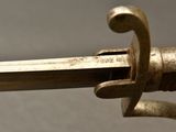 a close up of a sword with a metal handle