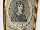 an old picture of a man with long hair in a gold frame