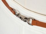 the belt is attached to the waist of a white dress