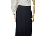 black and white dress on a mannequin stand on a white background